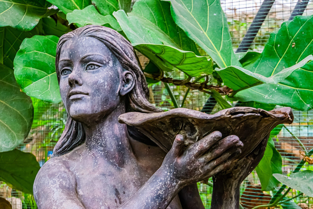 book reviews 30354794 beautiful closeup of the face of a female statue holding a bowl garden decorations and architecture
